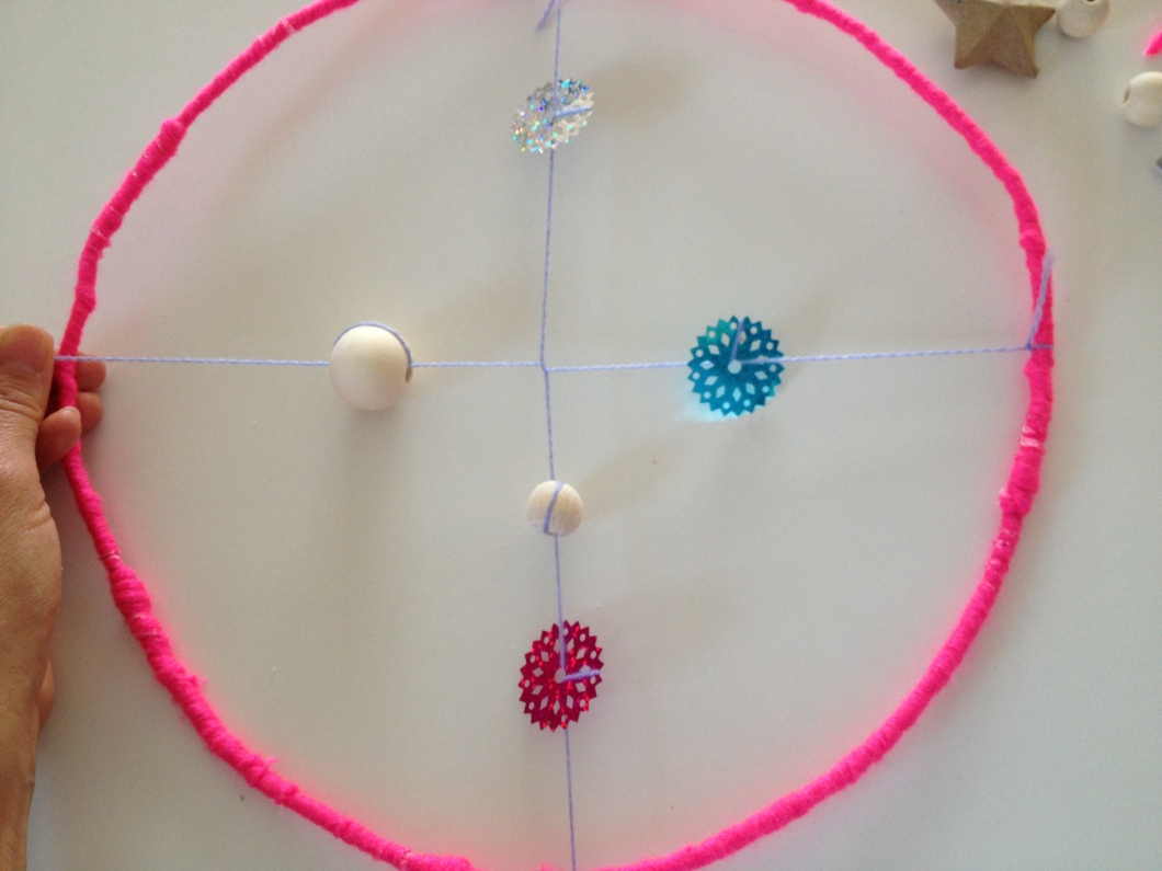 Now decorate the second half before tying it to the other side of your circle.