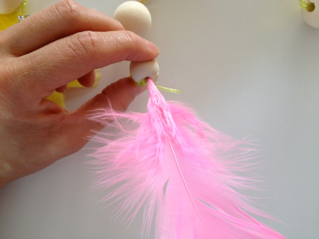 ...then place your feather into your bead.